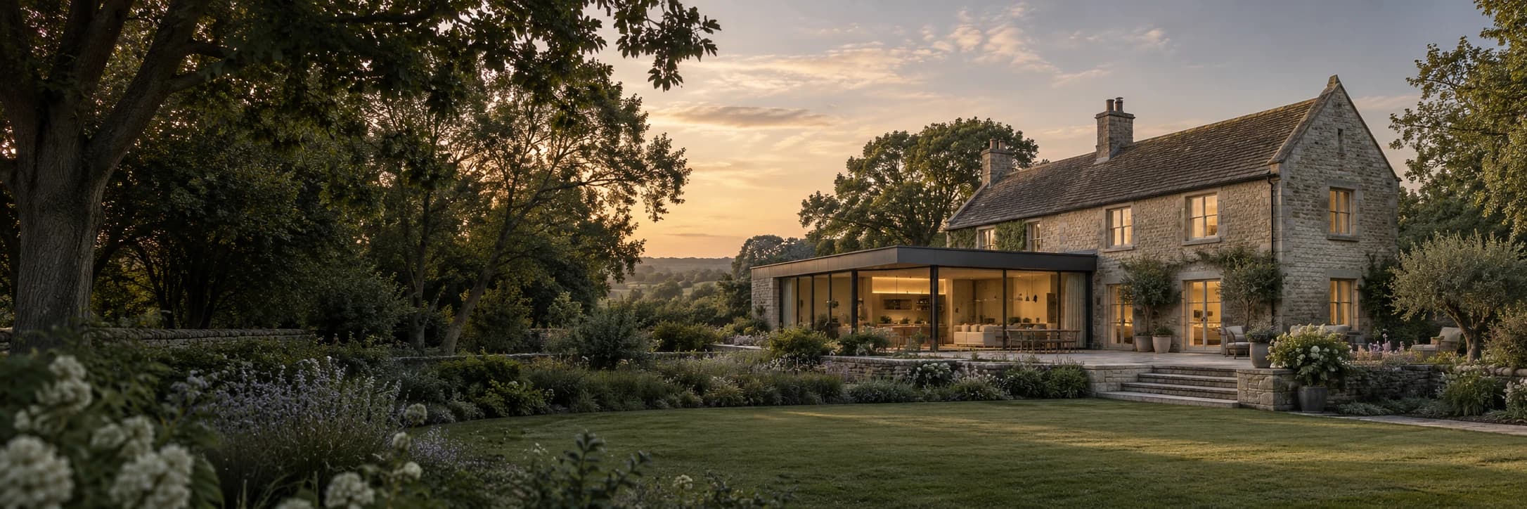 Illustrative residential design: a stone house with a contemporary glazed extension in an English garden